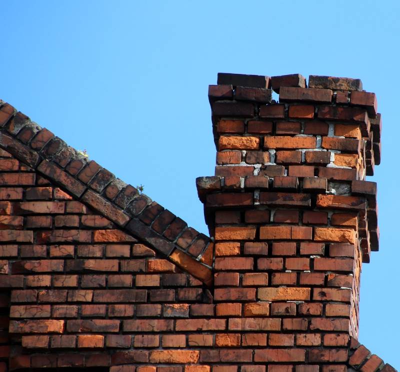 Signs Your Vernon Home Needs a Chimney Inspection Damaged chimney on an Vernon home showing cracks and missing mortar